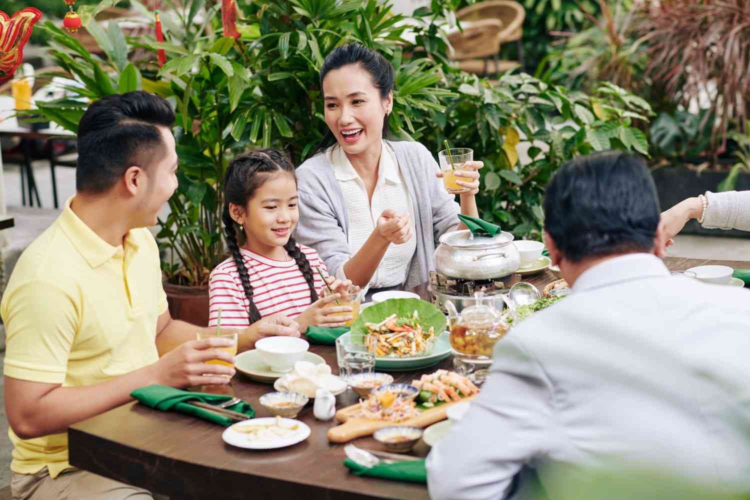 family enjoy meal at restaurant